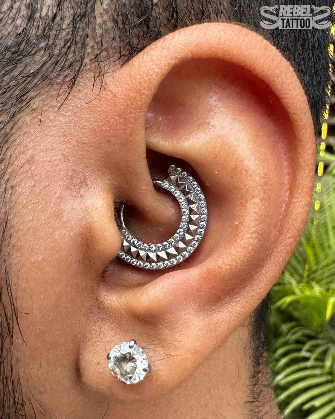 Daith piercing with Swarovski hoop in implant grade titanium, cartilage piercing at Rebel Tattoos Gurgaon
