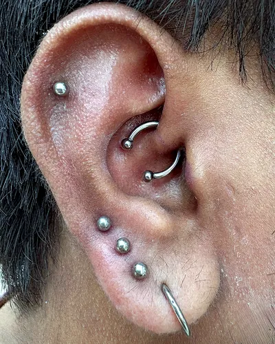Daith piercing, helix upper lobes at Rebel Tattoos, Sector 67 Gurgaon