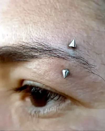 Eyebrow piercing, spike barbell at Rebel Tattoos, Sector 67 Gurgaon
