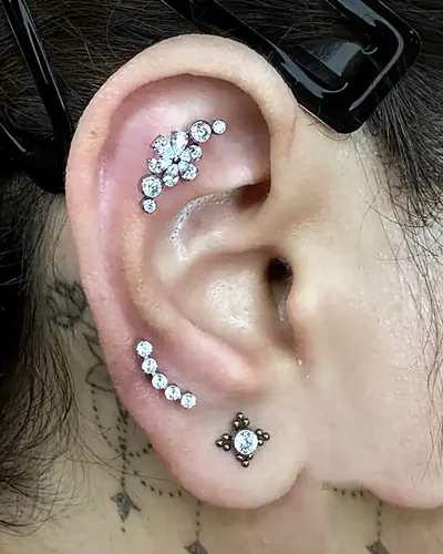 Helix piercing, cluster stacked lobes at Rebel Tattoos, Sector 67 Gurgaon