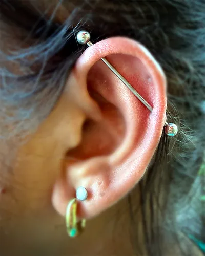 Industrial piercing, opal helix at Rebel Tattoos, Sector 67 Gurgaon