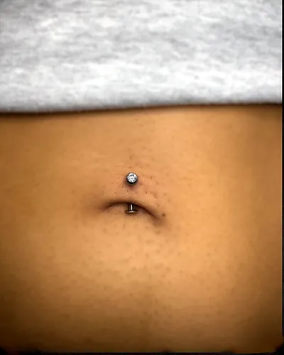 Navel piercing, curved barbell at Rebel Tattoos, Sector 67 Gurgaon