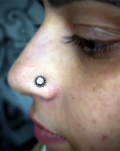 Nostril piercing, flower stud at Rebel Tattoos, Sector 67 Gurgaon