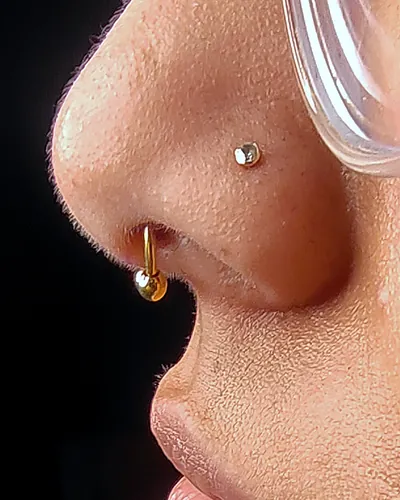 Nostril piercing, stud hoop at Rebel Tattoos, Sector 67 Gurgaon
