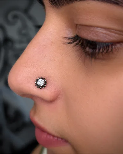 Nostril piercing, flower stud at Rebel Tattoos, Sector 67 Gurgaon