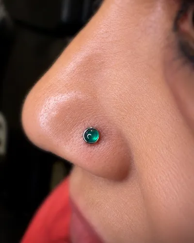 Nostril piercing, teal stone at Rebel Tattoos, Sector 67 Gurgaon