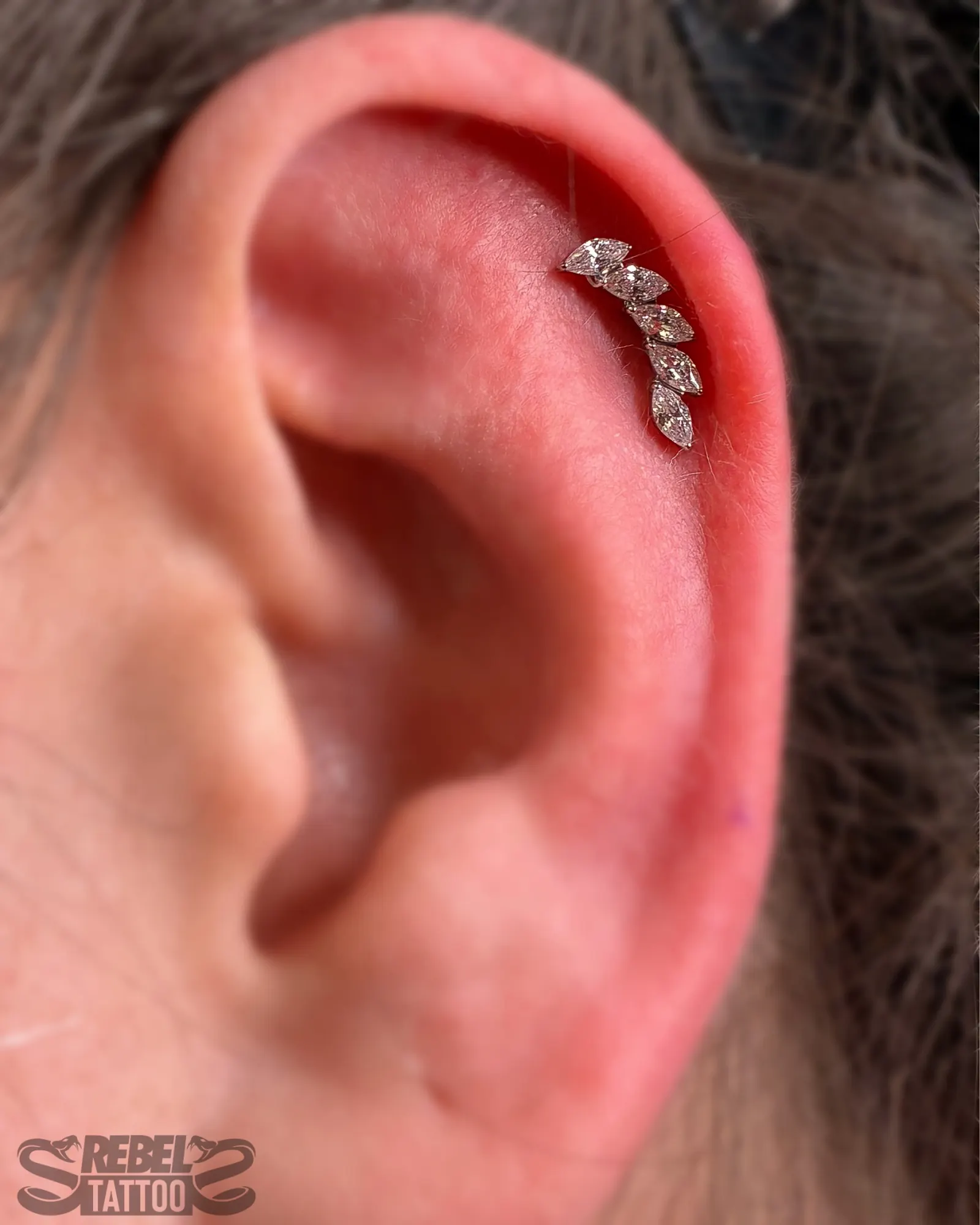 Russian helix piercing with marquise CZ stud in implant grade titanium at Rebel Tattoos Gurgaon