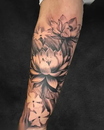 Lotus, botanical tattoo on the forearm, black and grey, at Rebel Tattoos, Sector 67 Gurgaon