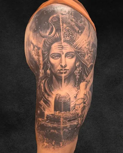 Ardhanareeshwara, devotional realism tattoo on the upper arm, black and grey, at Rebel Tattoos, Sector 67 Gurgaon