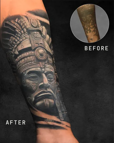 Aztec Mask, cover-up realism tattoo on the forearm, black and grey, at Rebel Tattoos, Sector 67 Gurgaon