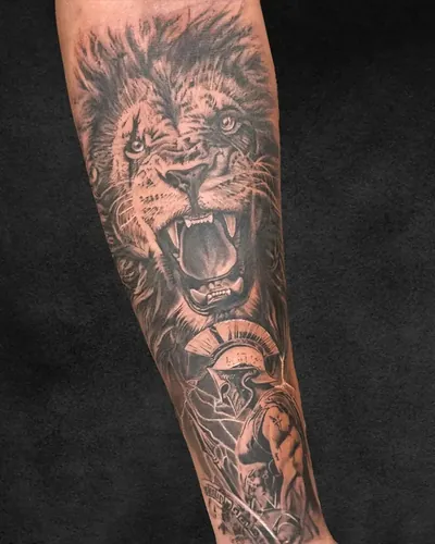 Lion and Spartan, realism tattoo on the forearm, black and grey, at Rebel Tattoos, Sector 67 Gurgaon