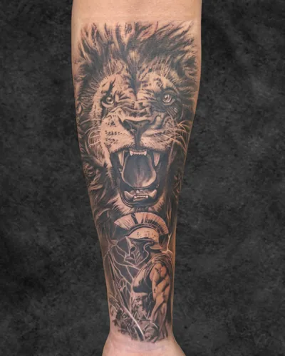 Lion and Spartan, realism tattoo on the forearm, black and grey, at Rebel Tattoos, Sector 67 Gurgaon