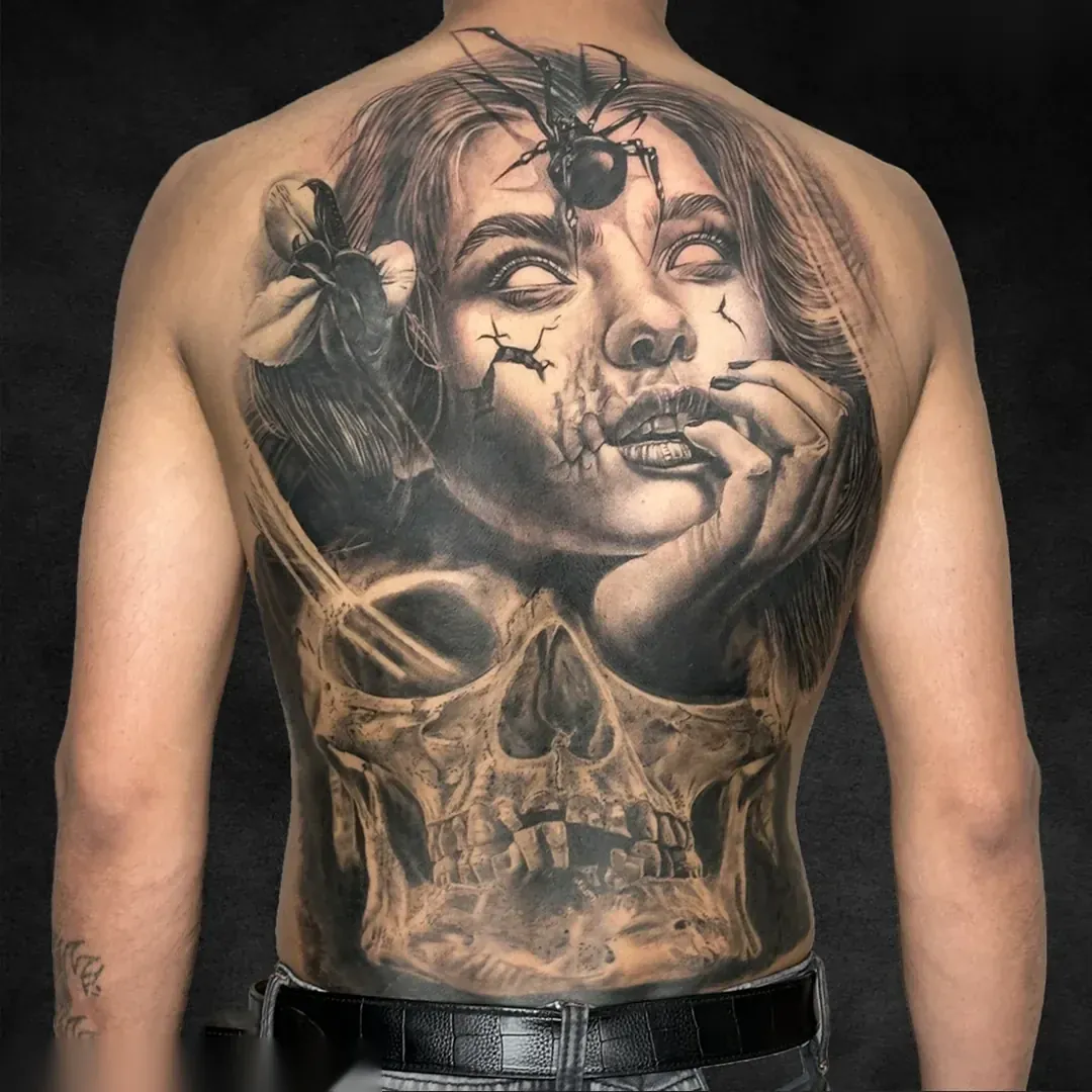 Spider and skull back piece, black and grey realism tattoo at Rebel Tattoos Gurgaon
