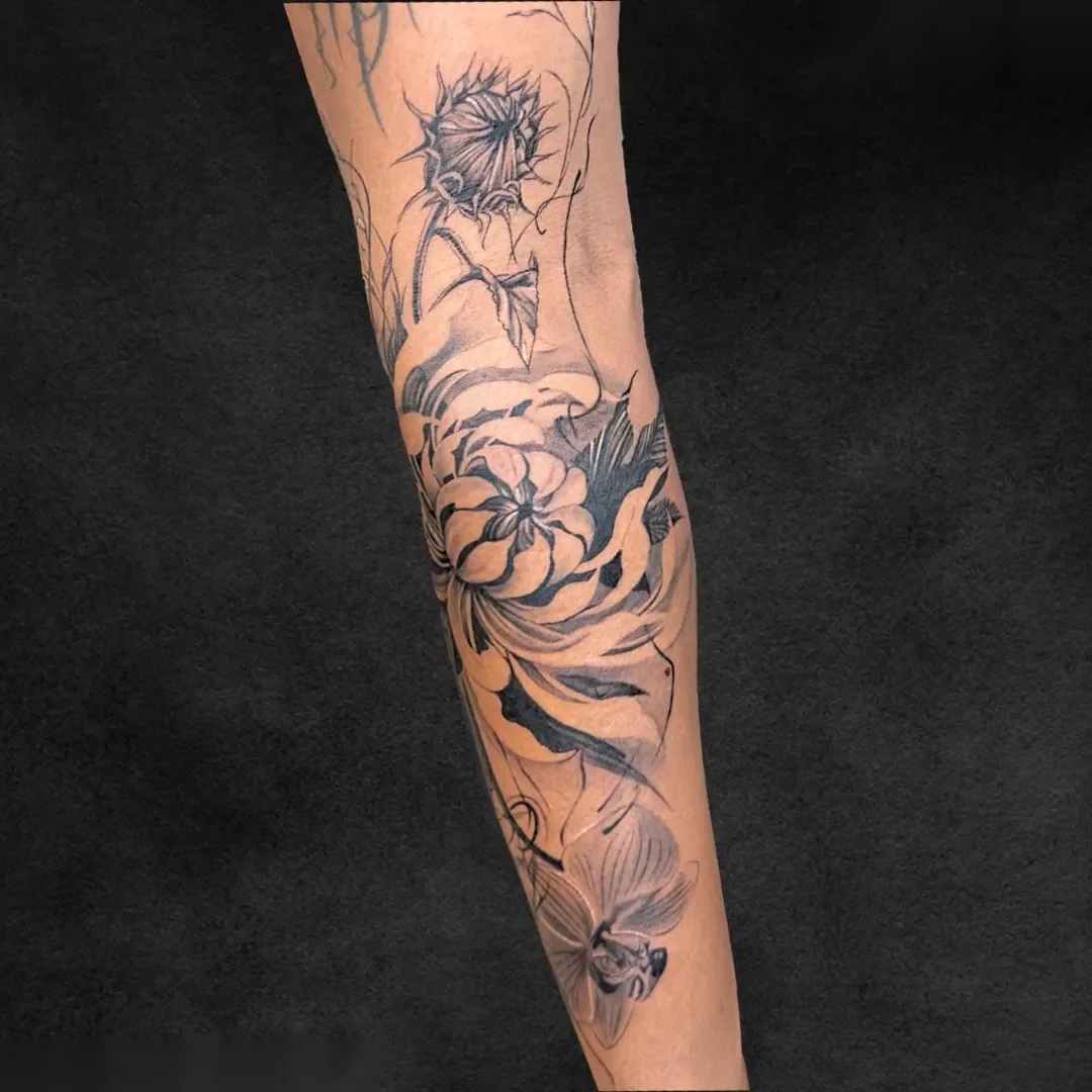 Chrysanthemum fine line botanical sleeve tattoo at Rebel Tattoos Gurgaon