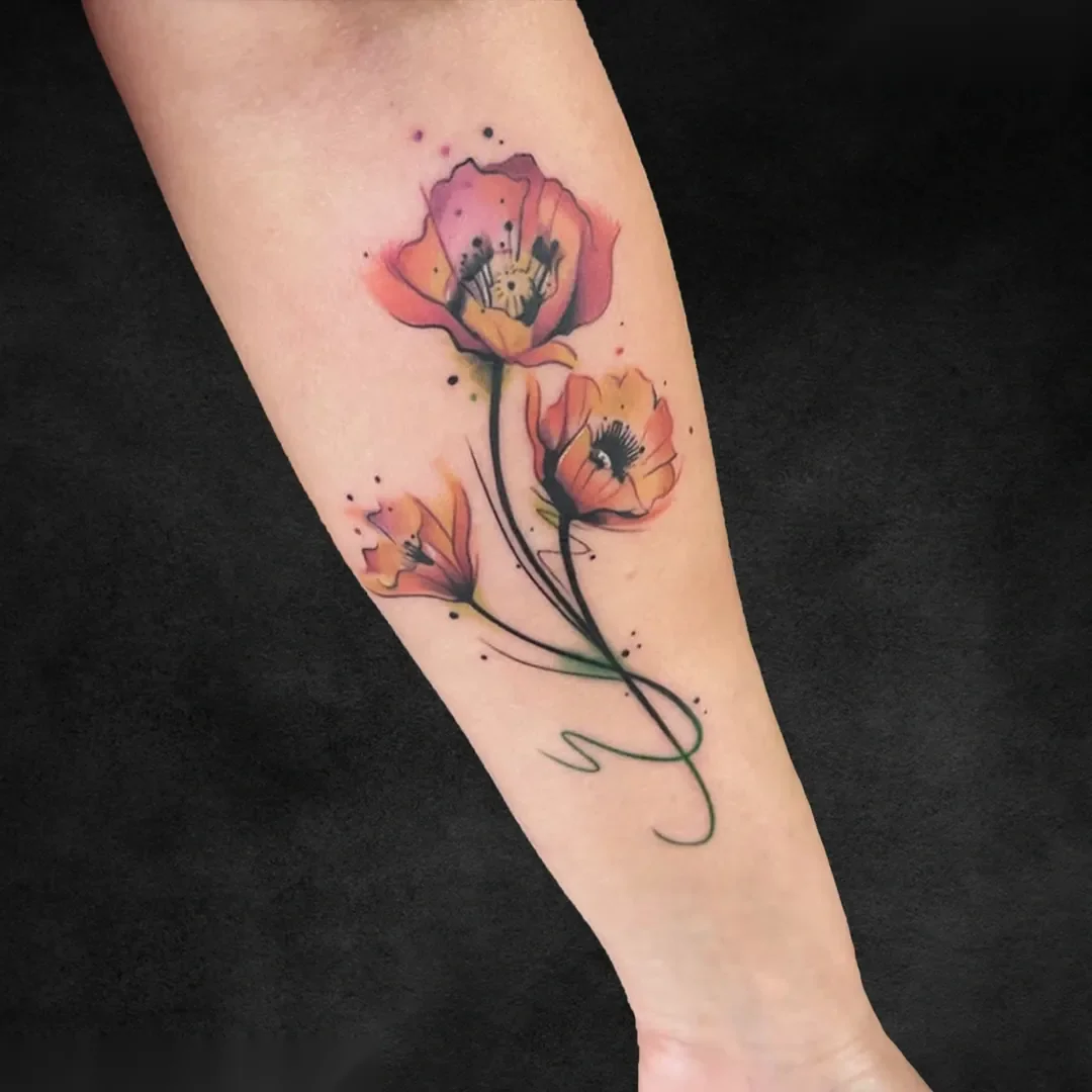 Watercolour poppy flower forearm tattoo at Rebel Tattoos Gurgaon