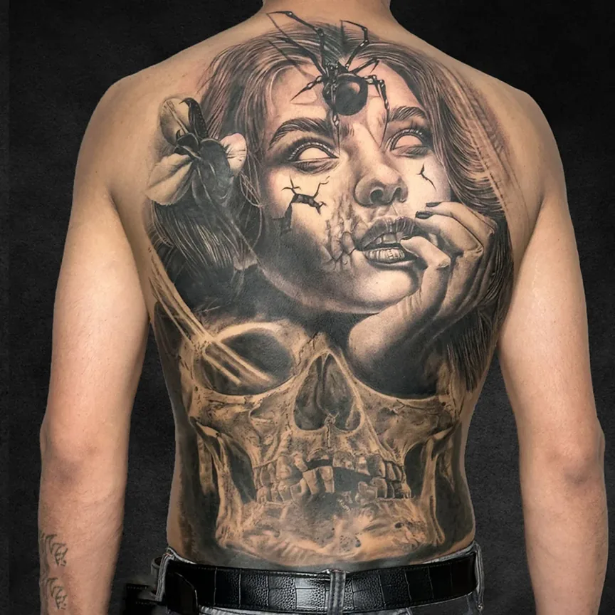 Spider and skull back piece, black and grey realism tattoo at Rebel Tattoos Gurgaon